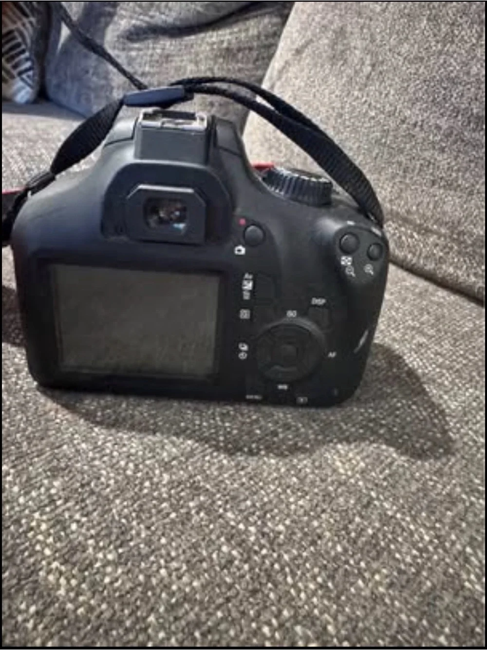 Canon DSLR Camera with Black Body and Red-Trim Strap